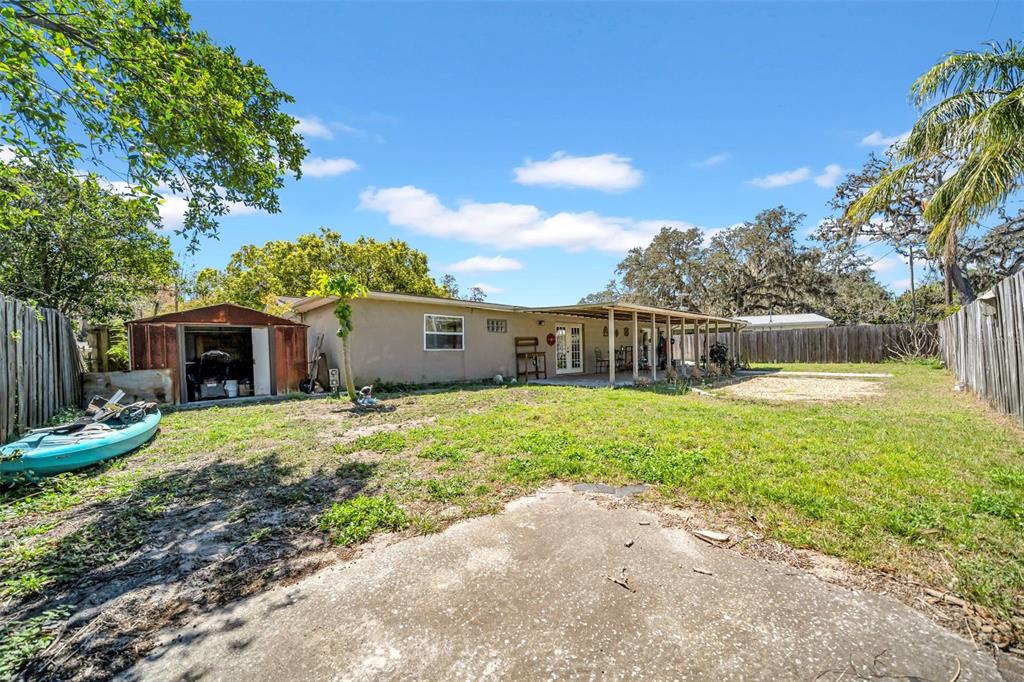 7353 Banner Street New Port Richey, FL 34653 - Photo 38 of 49 a front view of a house with a yard and trees