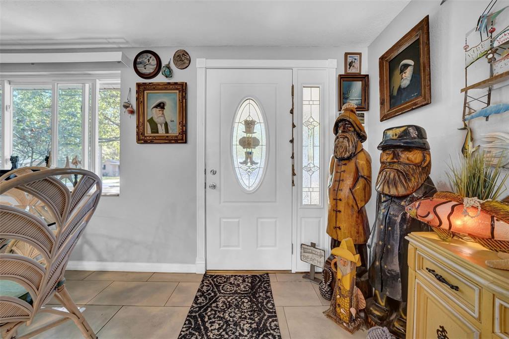 7353 Banner Street New Port Richey, FL 34653 - Photo 5 of 49 a view of walk in closet with clothes and shoes