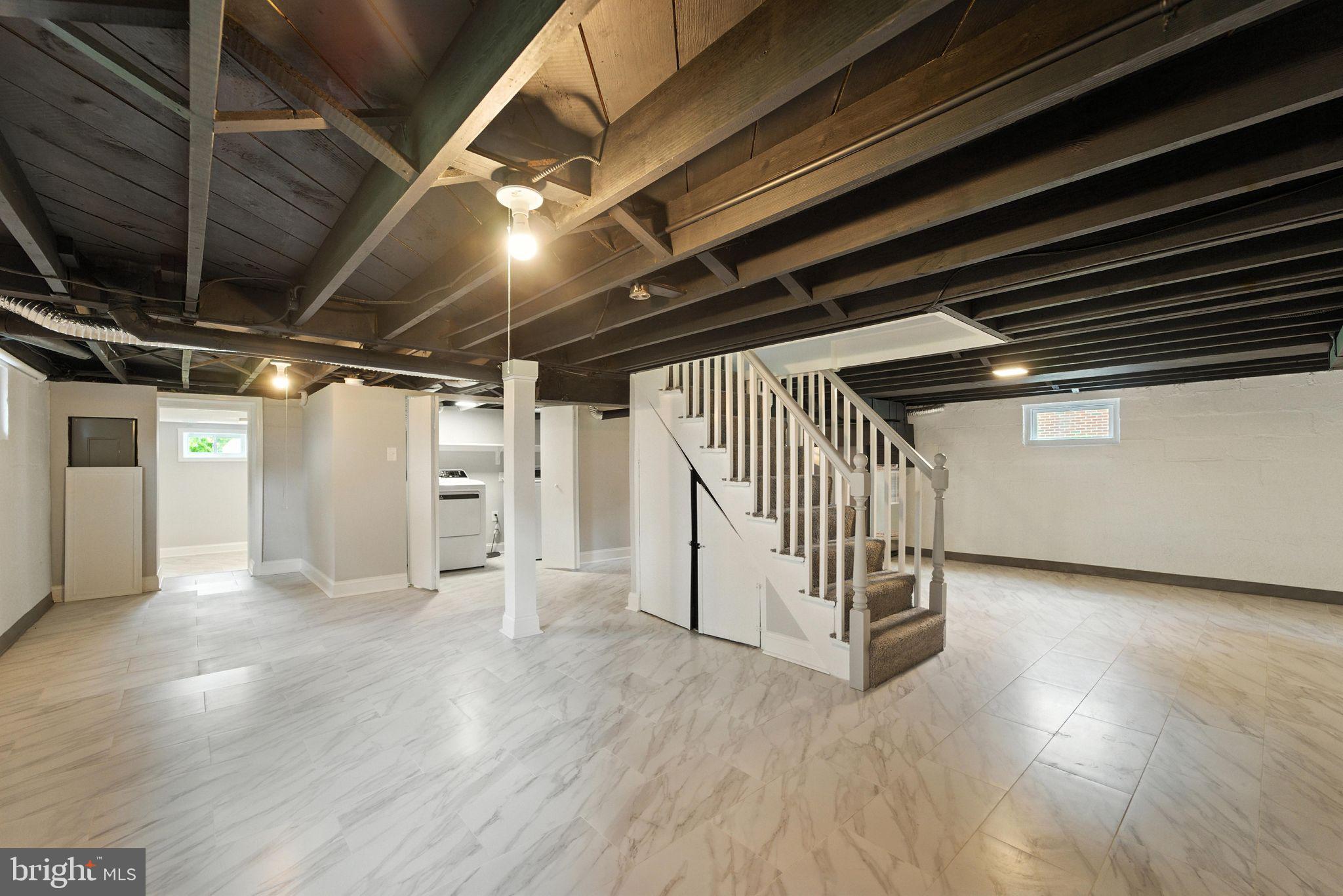 1608 Howard Avenue Baltimore, MD 21221 - Photo 26 of 31 FINISHED BASEMENT CERAMIC FLOORING