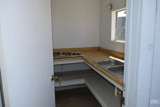 a kitchen with a sink and cabinets