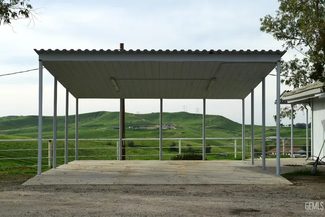 a view of a house with a backyard porch and sitting area