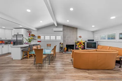 a view of a dining room with furniture and wooden floor