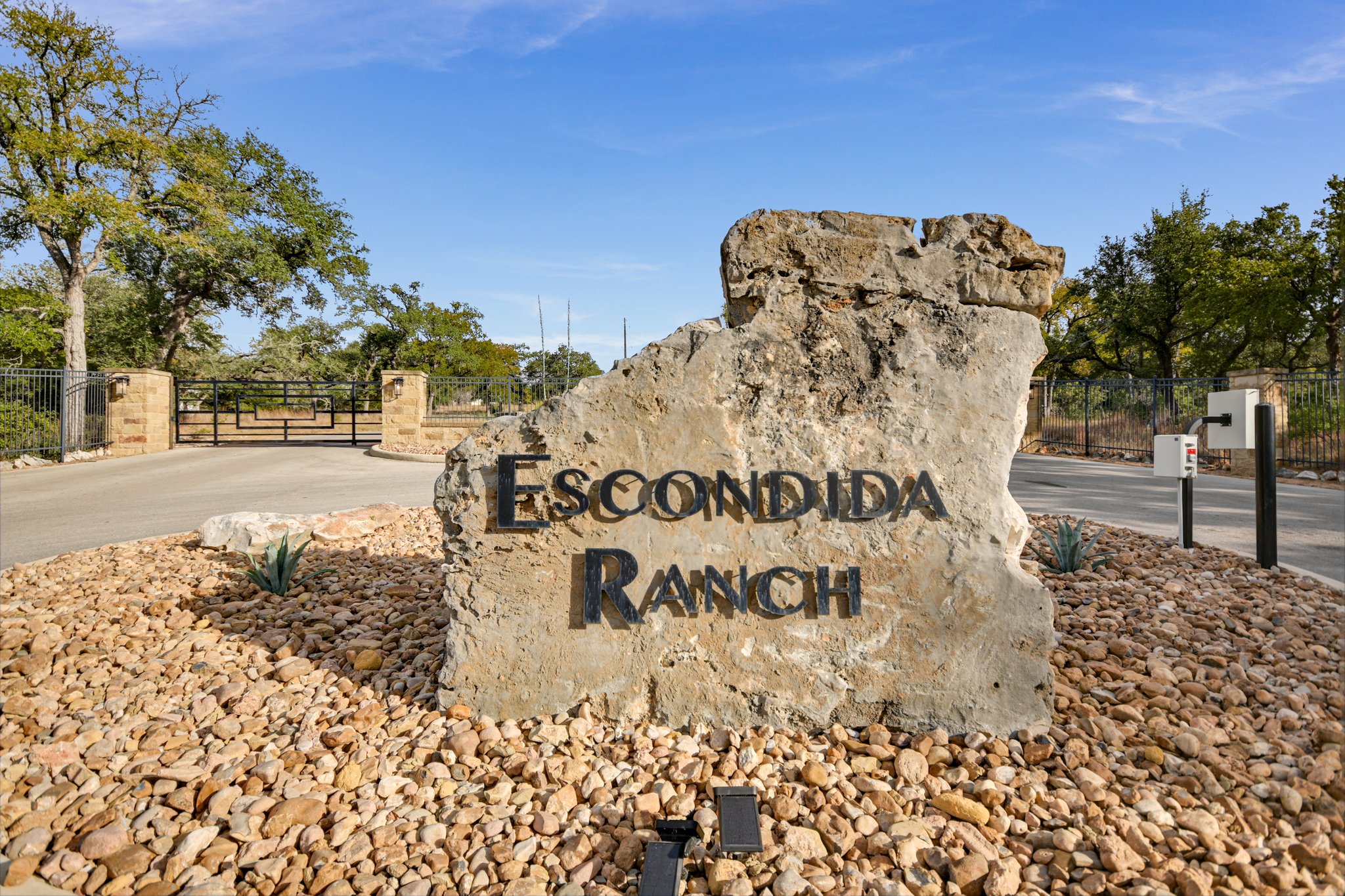717 Puerto Rico Drive Wimberley, TX 78676 - Photo 1 of 1 a view of a road with a building in the background