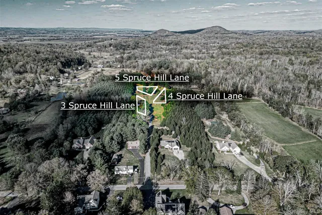 an aerial view of residential house with outdoor space and river