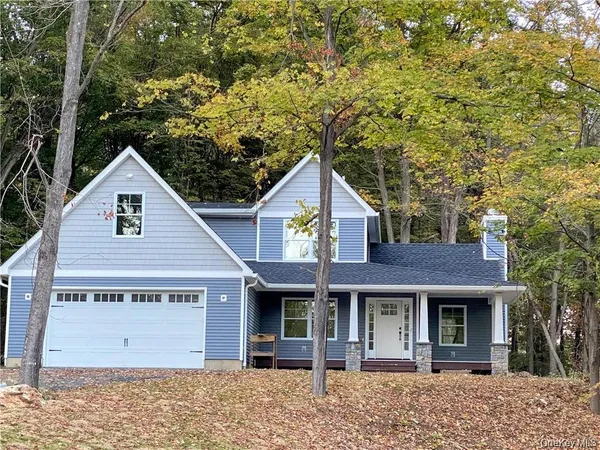 a view of a house with a tree