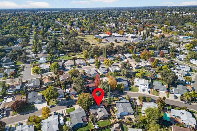 an aerial view of residential houses with outdoor space