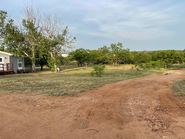a view of a lake with a house in the background