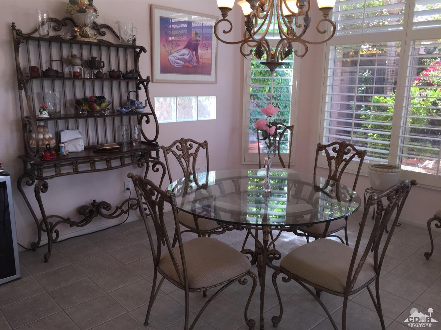 37339 Skycrest Road Palm Desert, CA 92211 - Photo 15 of 39 a view of a dining room with furniture window and outside view