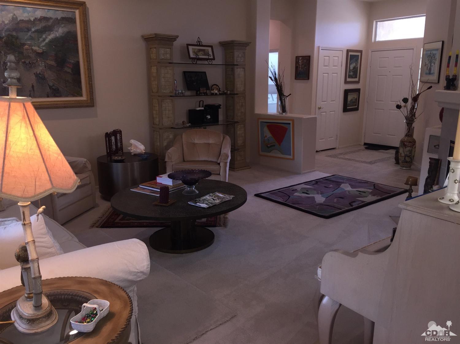 37339 Skycrest Road Palm Desert, CA 92211 - Photo 16 of 39 a living room with furniture and a fireplace