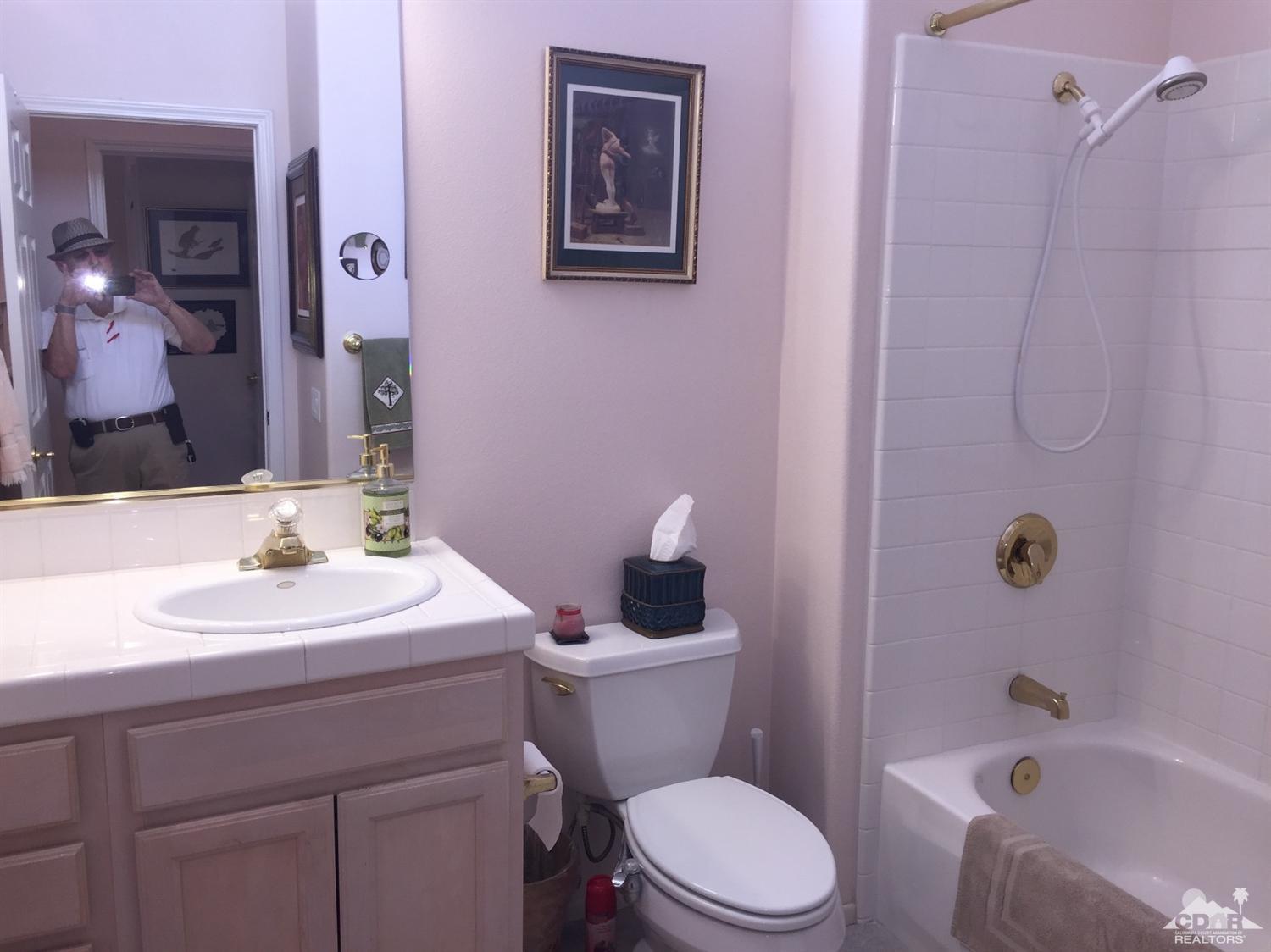 37339 Skycrest Road Palm Desert, CA 92211 - Photo 19 of 39 a bathroom with a sink toilet and shower