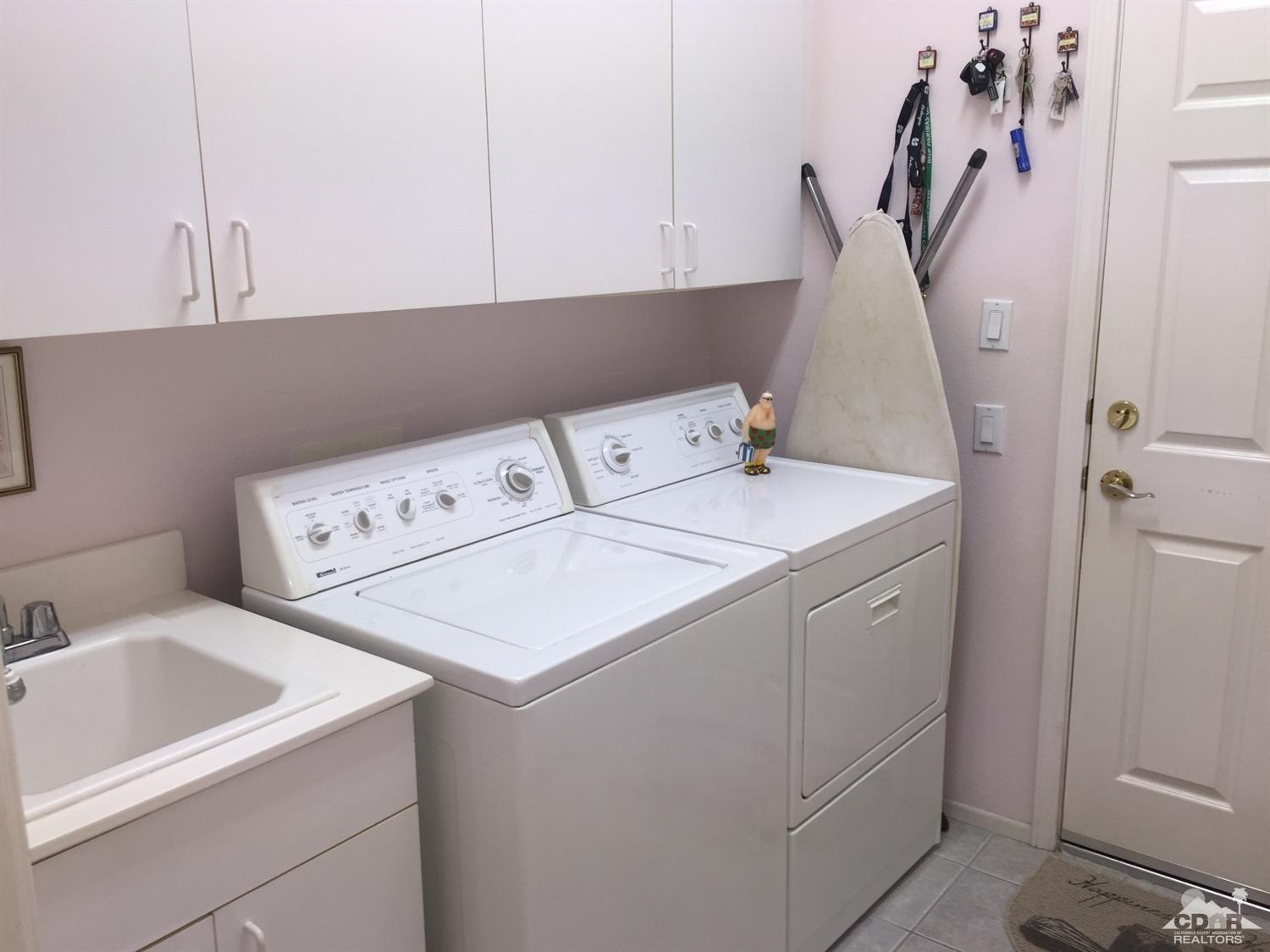 37339 Skycrest Road Palm Desert, CA 92211 - Photo 22 of 39 a utility room with dryer and washer