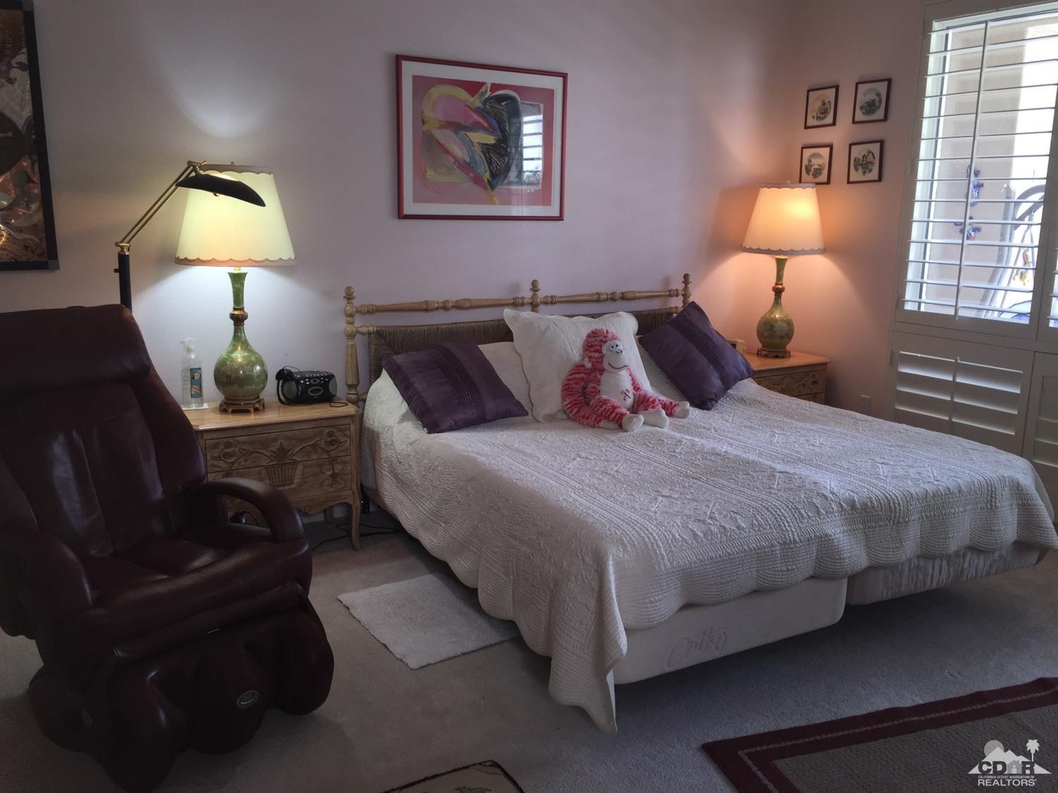 37339 Skycrest Road Palm Desert, CA 92211 - Photo 28 of 39 a bed room with a bed and a lamp
