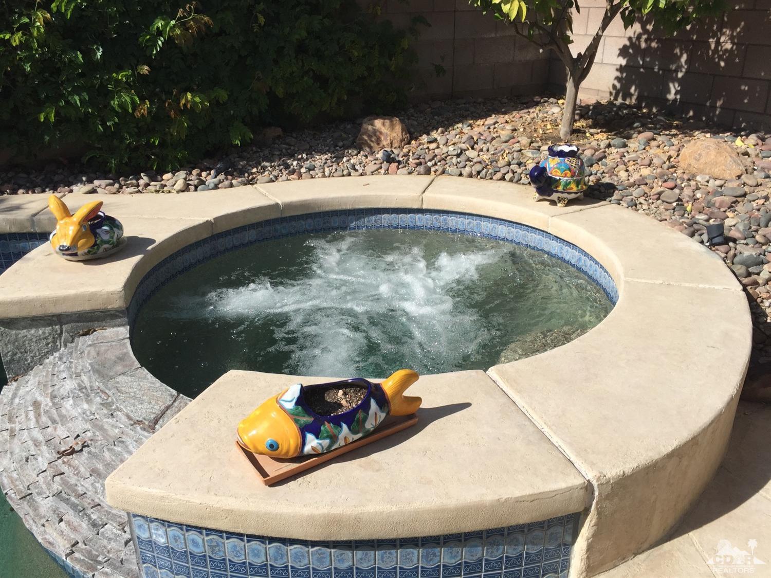 37339 Skycrest Road Palm Desert, CA 92211 - Photo 31 of 39 a view of a swimming pool in a back yard