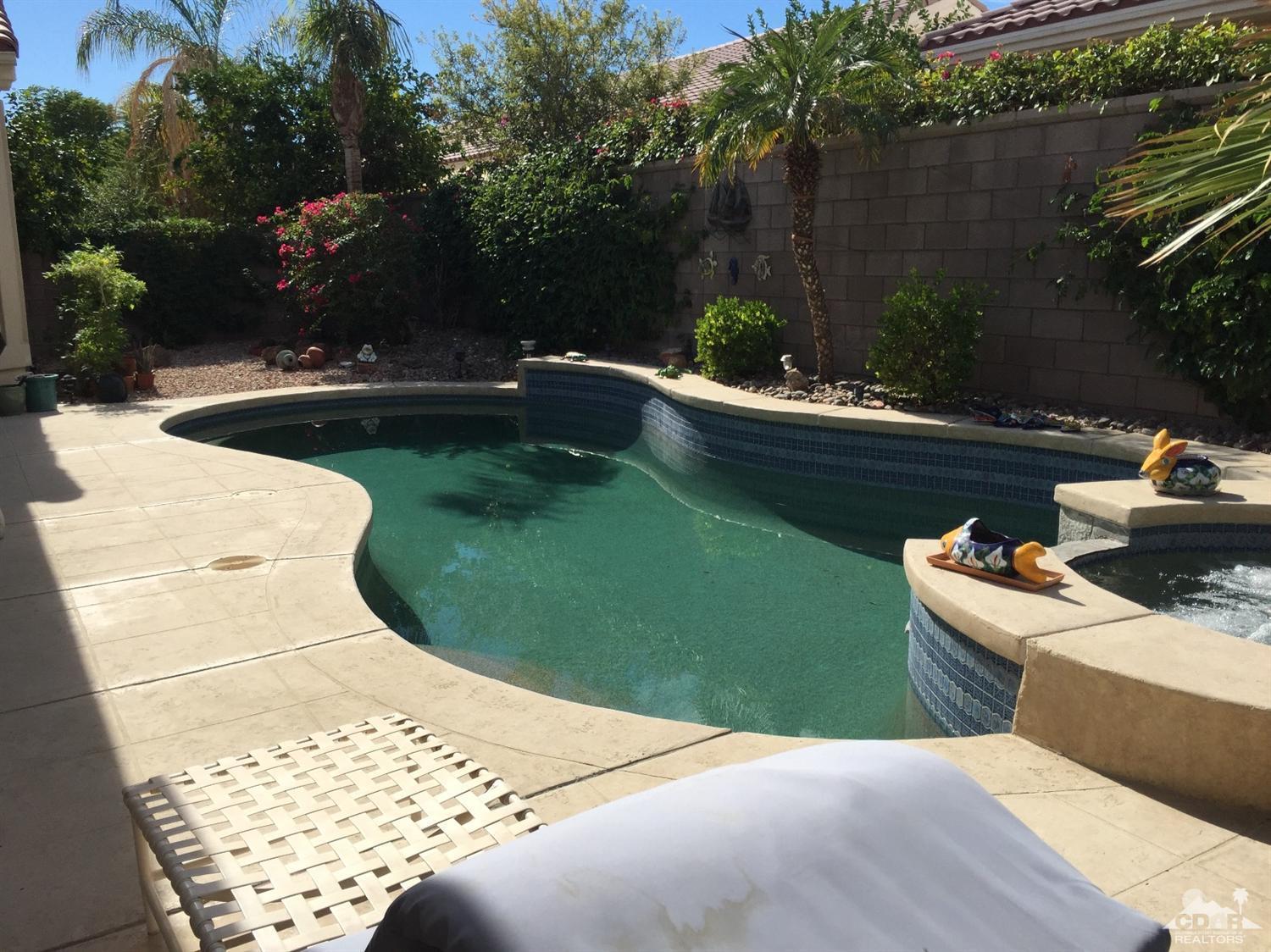 37339 Skycrest Road Palm Desert, CA 92211 - Photo 32 of 39 a view of a swimming pool with a patio