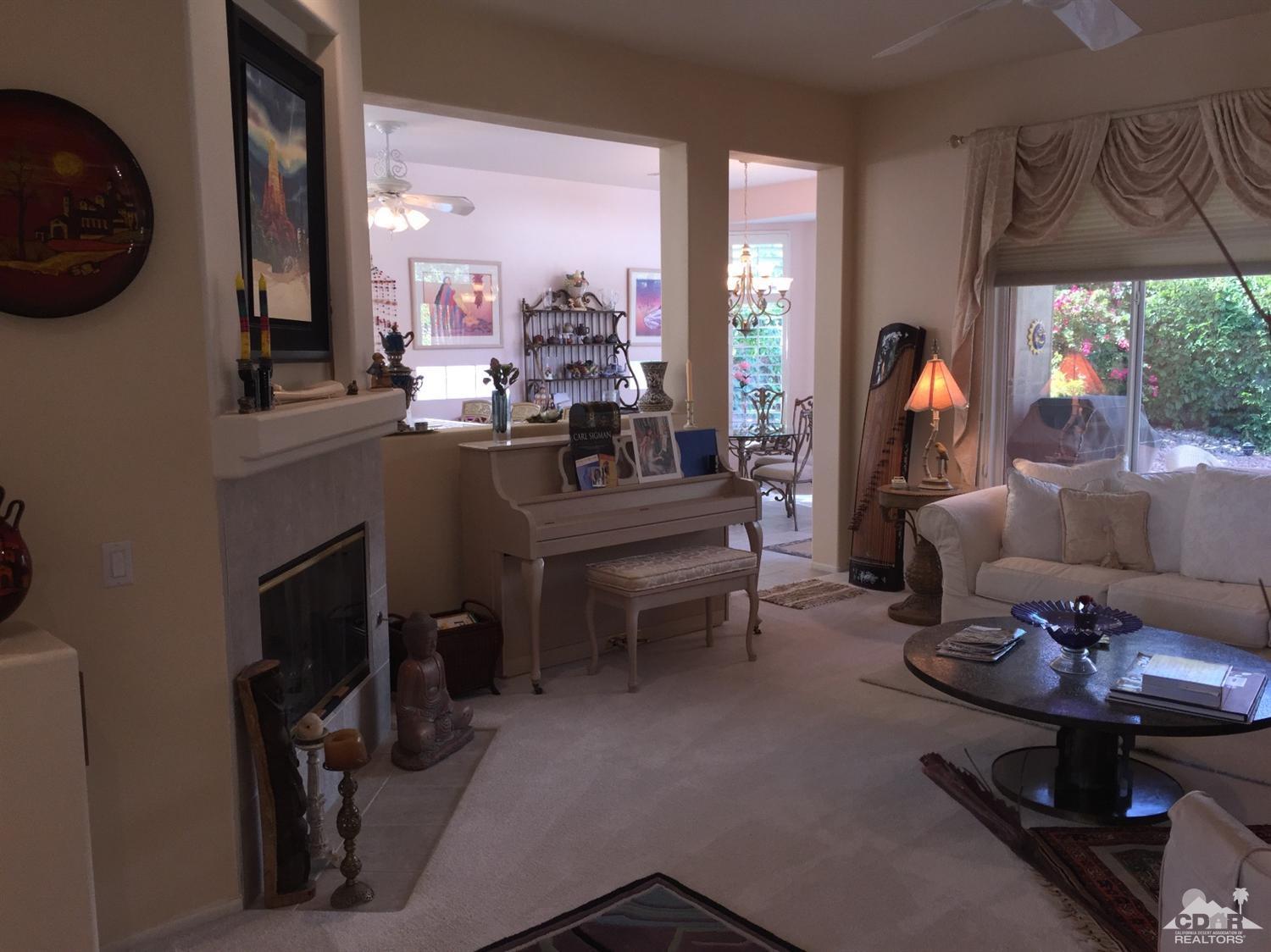 37339 Skycrest Road Palm Desert, CA 92211 - Photo 10 of 39 a living room with furniture and a fireplace