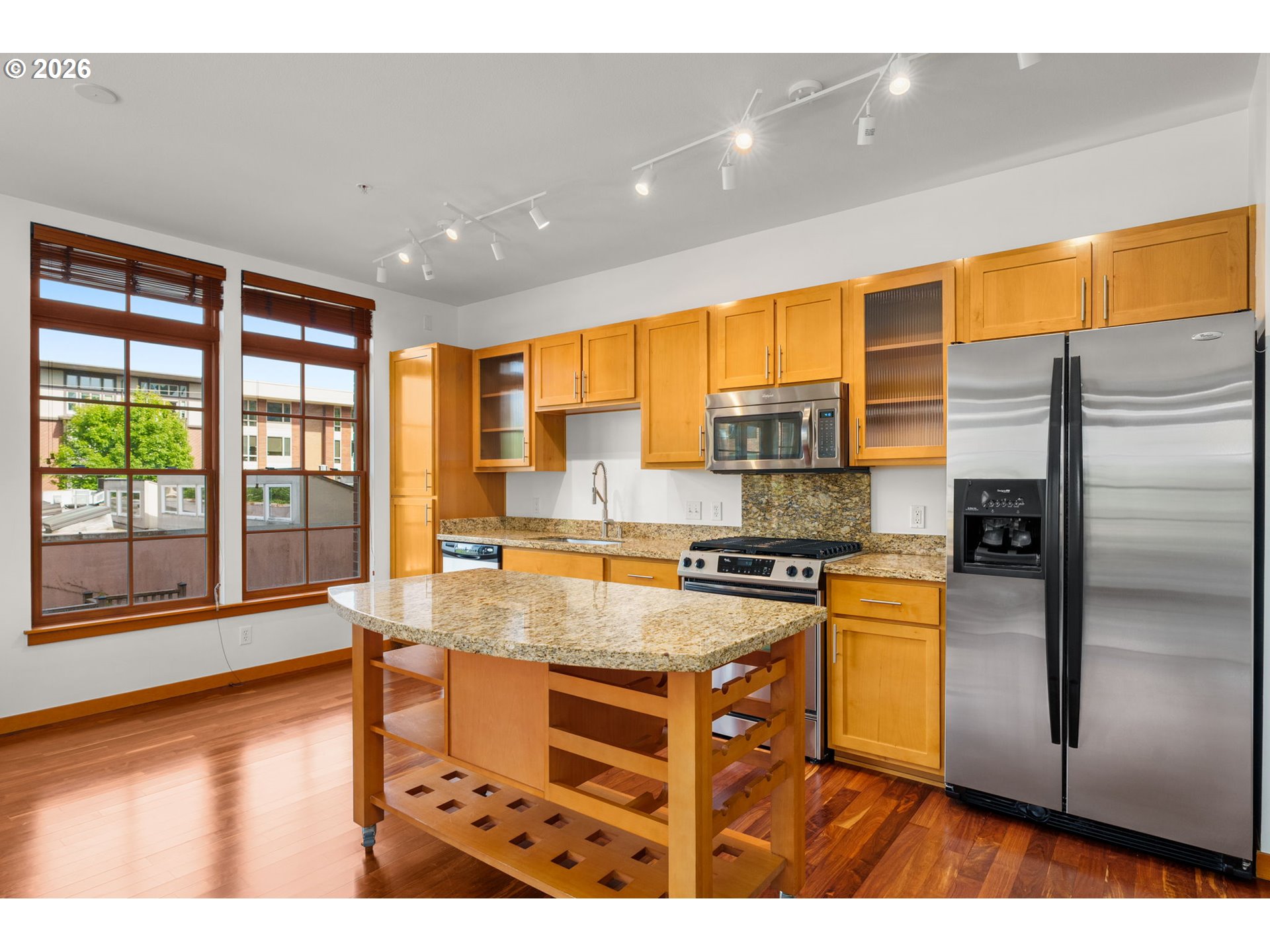 2350 Northwest Savier Street, Unit 224 Portland, OR 97210 - Photo 7 of 19 a kitchen with stainless steel appliances granite countertop a refrigerator a stove and a sink