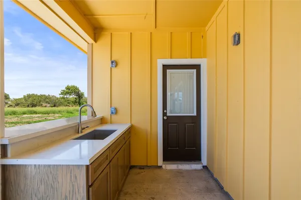 a bathroom with a sink and a large mirror