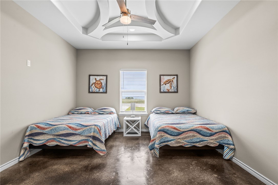 1263 East 2360th Circle Riviera, TX 78379 - Photo 20 of 40 a bedroom with a bed and wooden floor