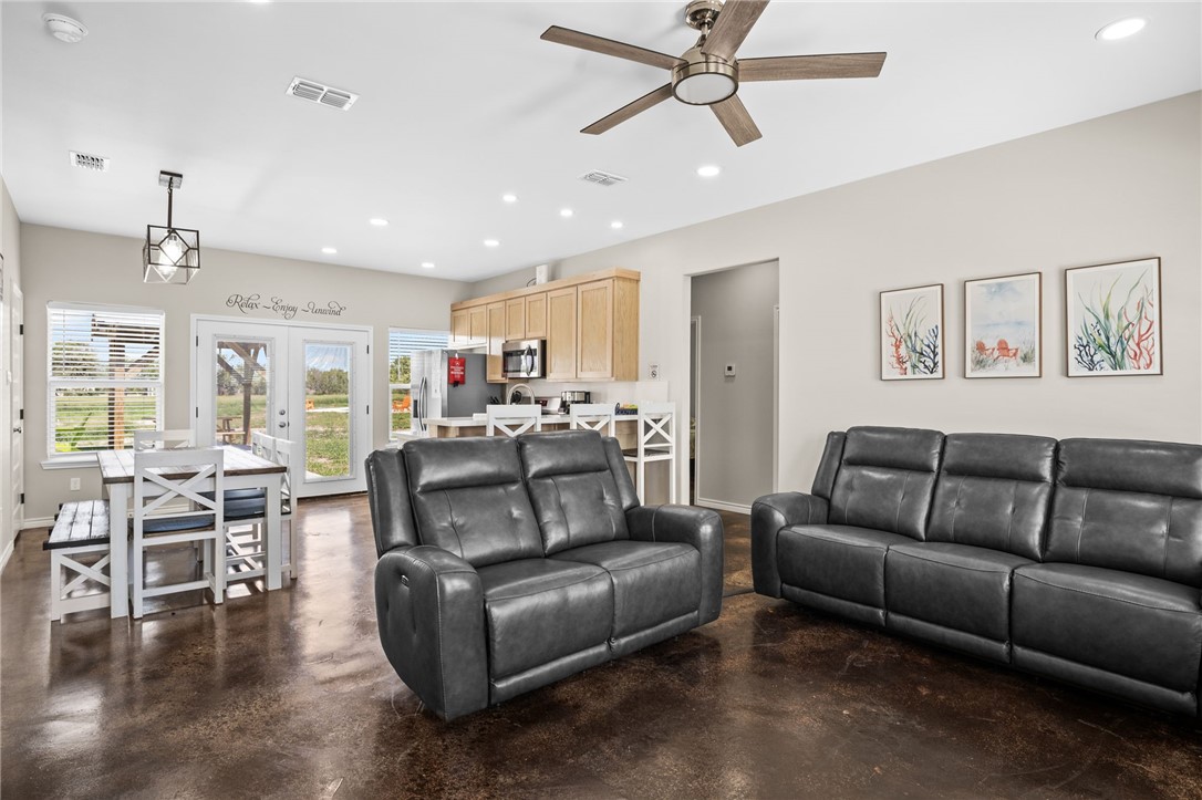 1263 East 2360th Circle Riviera, TX 78379 - Photo 28 of 40 a living room with furniture and a view of kitchen