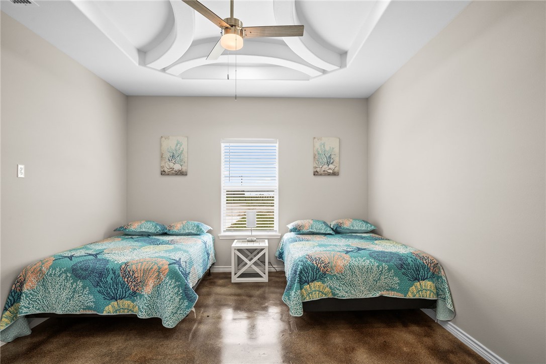 1263 East 2360th Circle Riviera, TX 78379 - Photo 32 of 40 a bedroom with a bed and a window