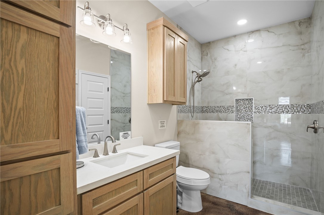 1263 East 2360th Circle Riviera, TX 78379 - Photo 33 of 40 a bathroom with a sink toilet and shower