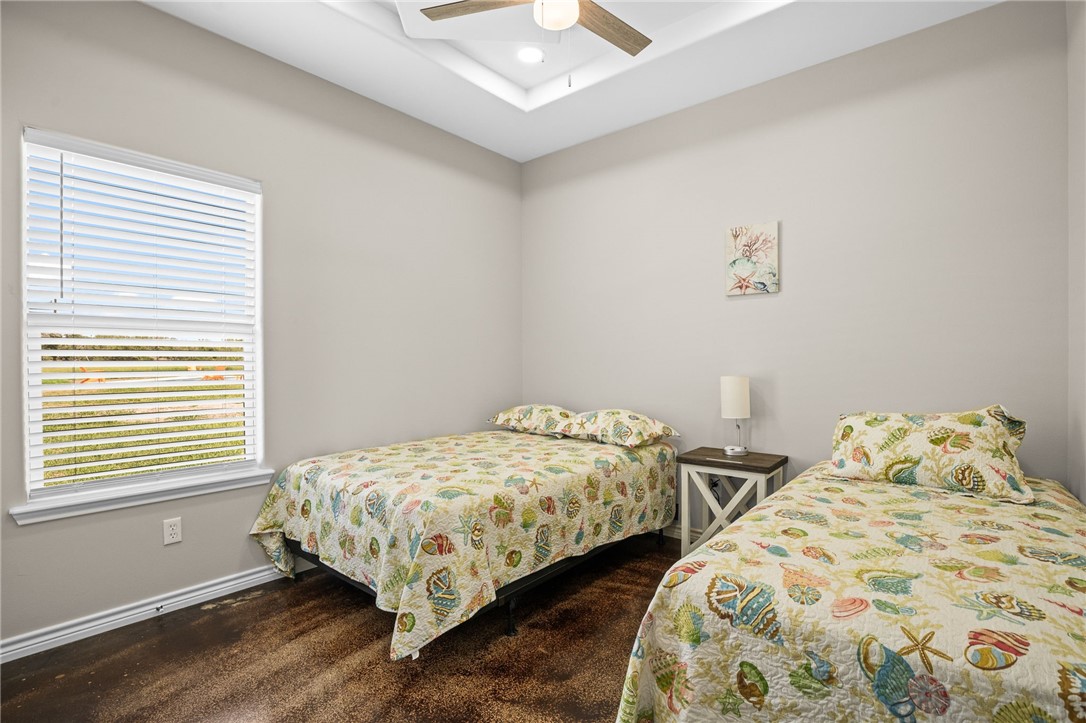 1263 East 2360th Circle Riviera, TX 78379 - Photo 36 of 40 a bedroom with two beds and a window