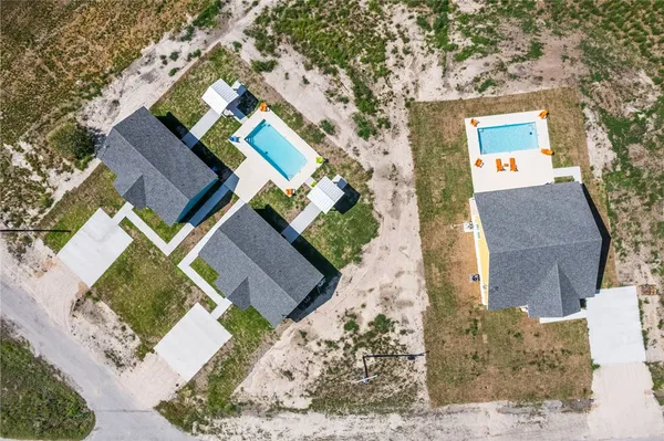 aerial view of a house with a yard
