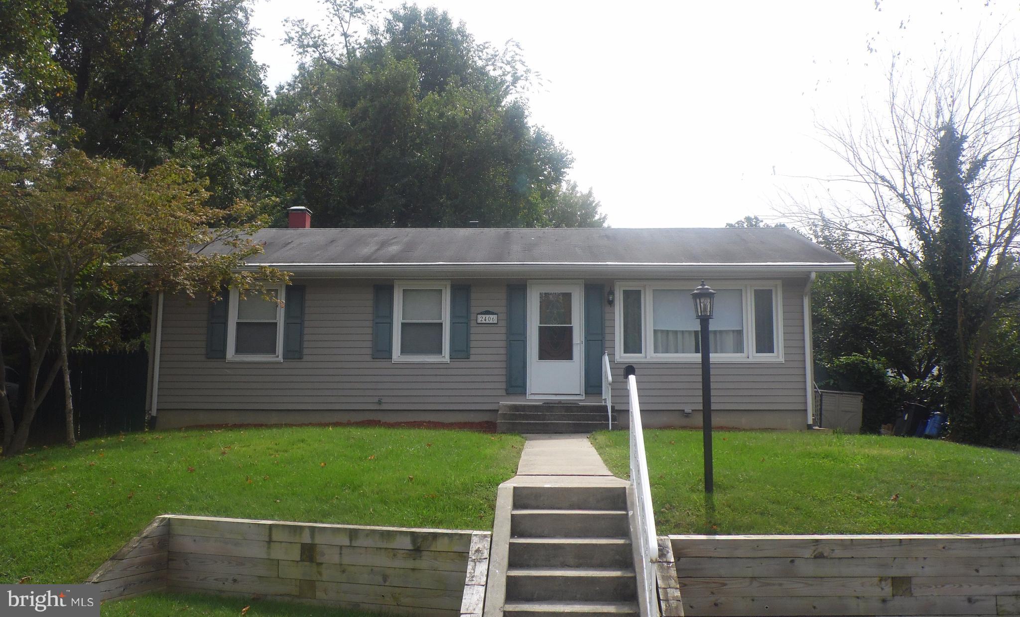 2406 Windsor Road Baltimore, MD 21234 - Photo 1 of 20 a front view of a house with a yard