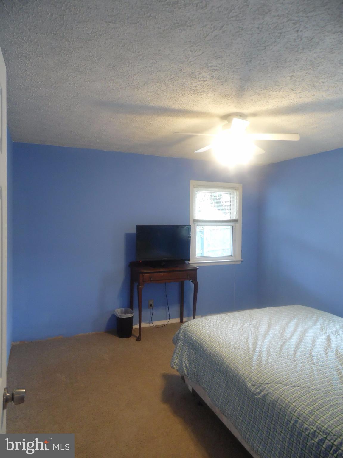 2406 Windsor Road Baltimore, MD 21234 - Photo 11 of 20 a bedroom with a bed and a window