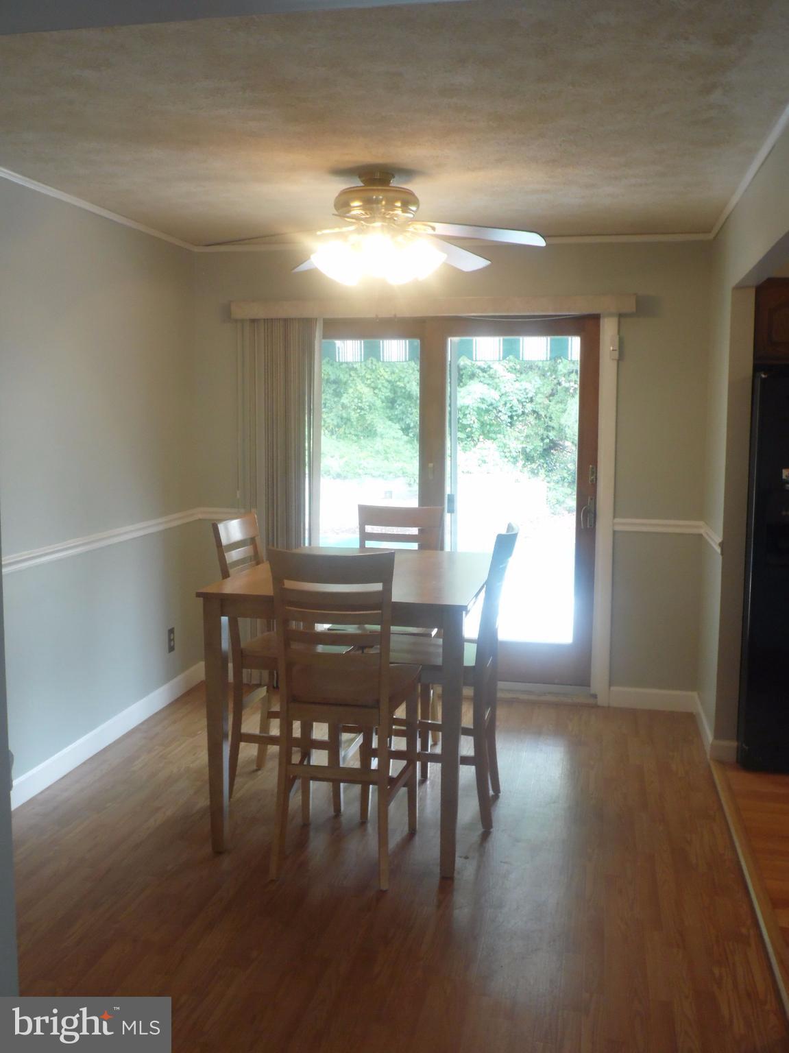 2406 Windsor Road Baltimore, MD 21234 - Photo 4 of 20 a view of a dining room with furniture window and outside view
