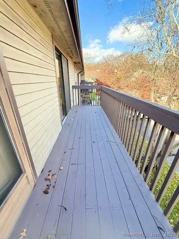 a view of balcony with wooden floor