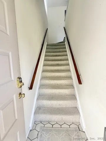 a view of staircase with white walls and white walls