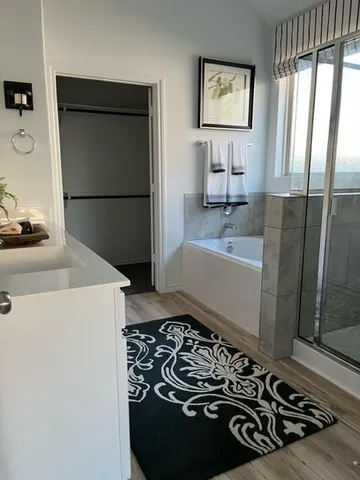 a bathroom with a bathtub and a sink