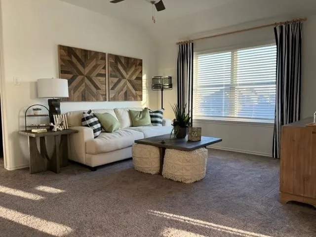 a living room with furniture and window