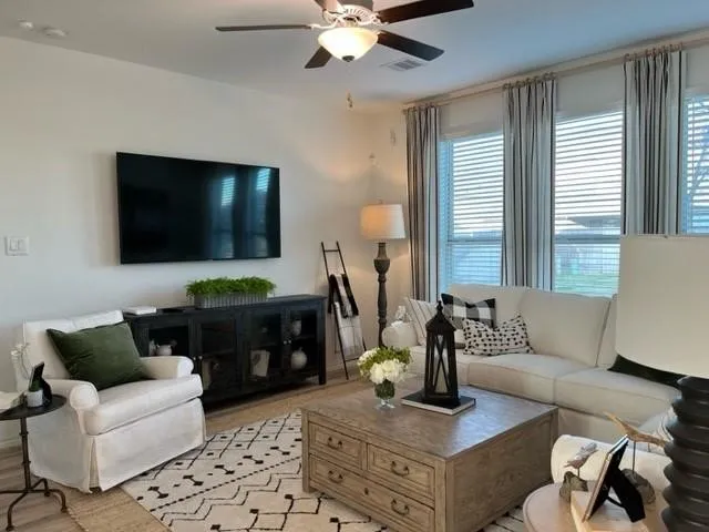 a living room with furniture and a flat screen tv