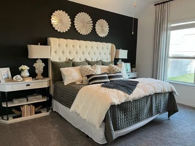 a bedroom with a bed and window