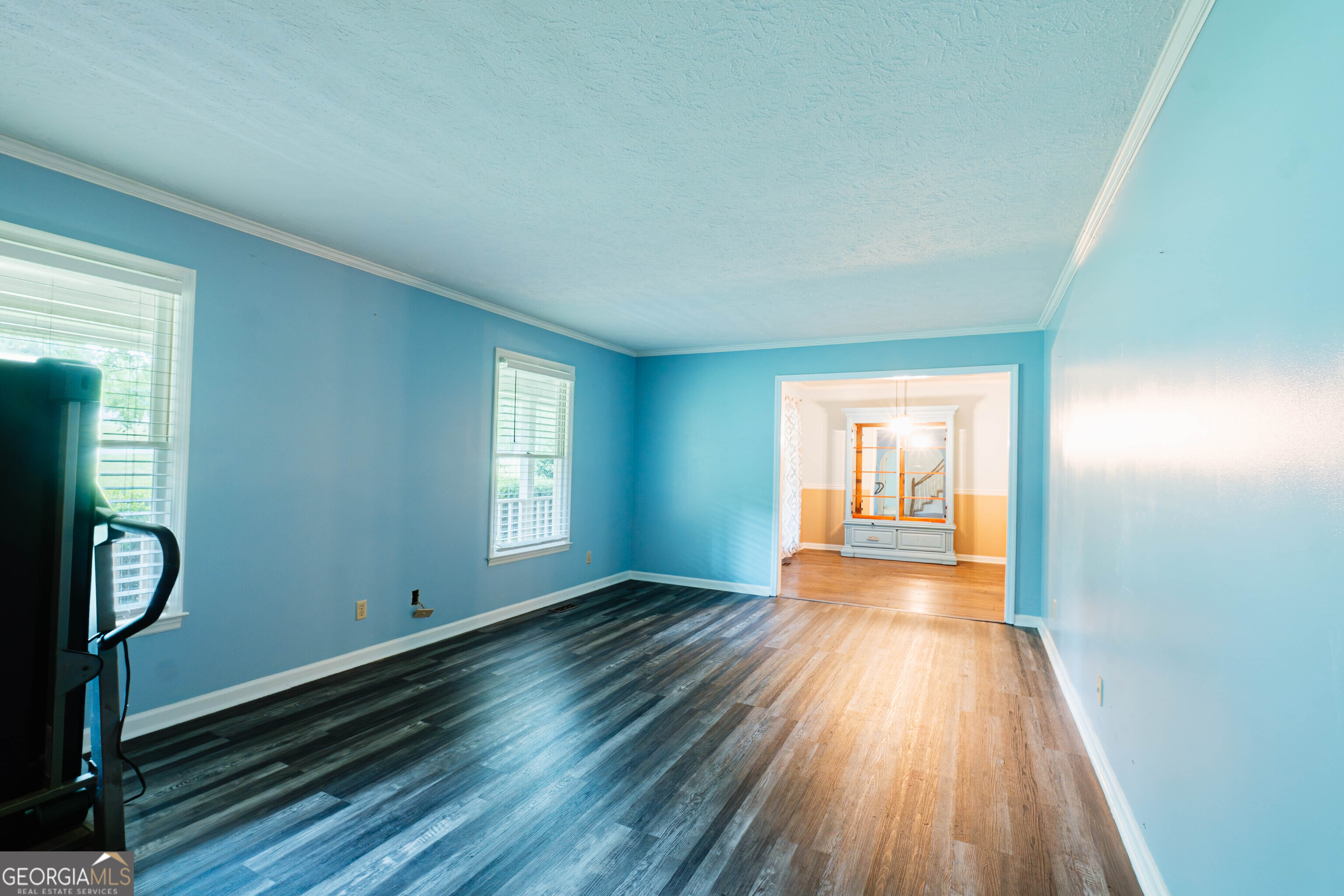 139 Cords Bridge Road Northeast Milledgeville, GA 31061 - Photo 10 of 35 a view of an empty room with wooden floor and a window
