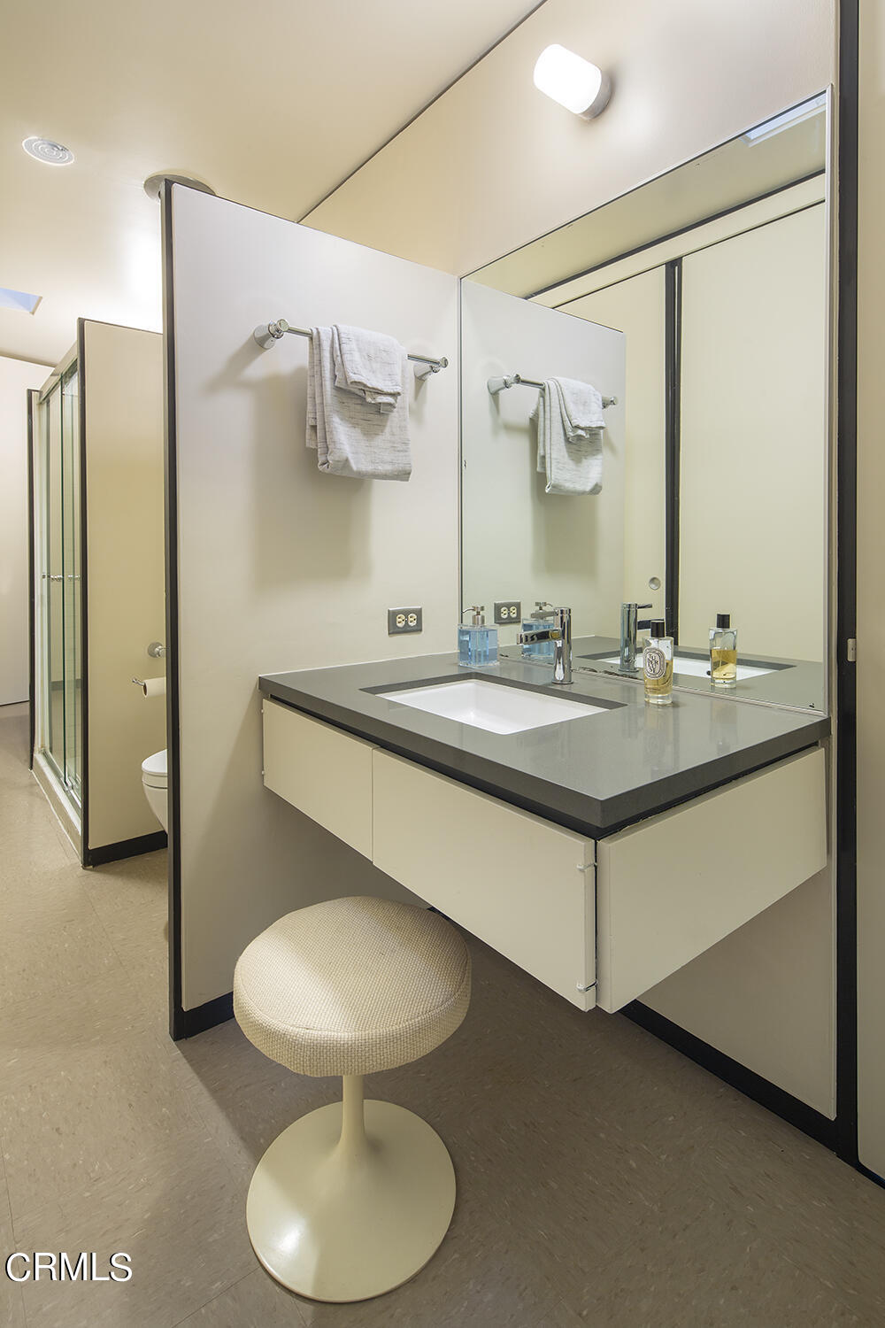 215 La Vereda Road Pasadena, CA 91105 - Photo 12 of 21 a bathroom with a sink and a mirror