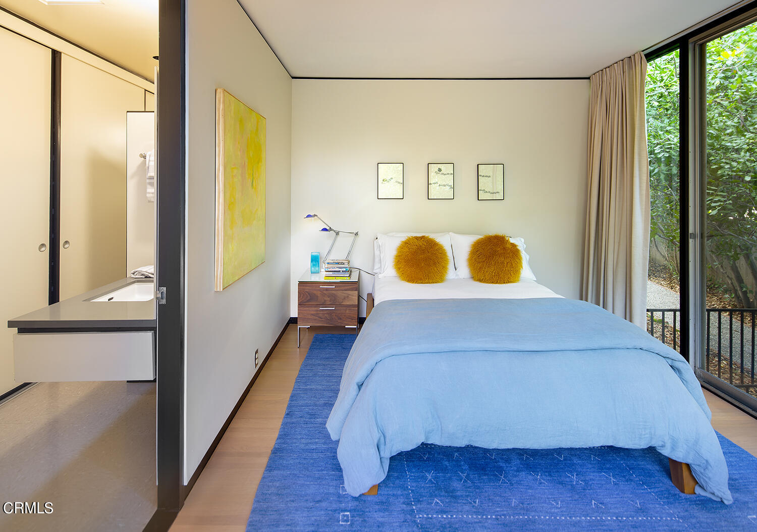 215 La Vereda Road Pasadena, CA 91105 - Photo 13 of 21 a bed sitting in a bedroom next to a window