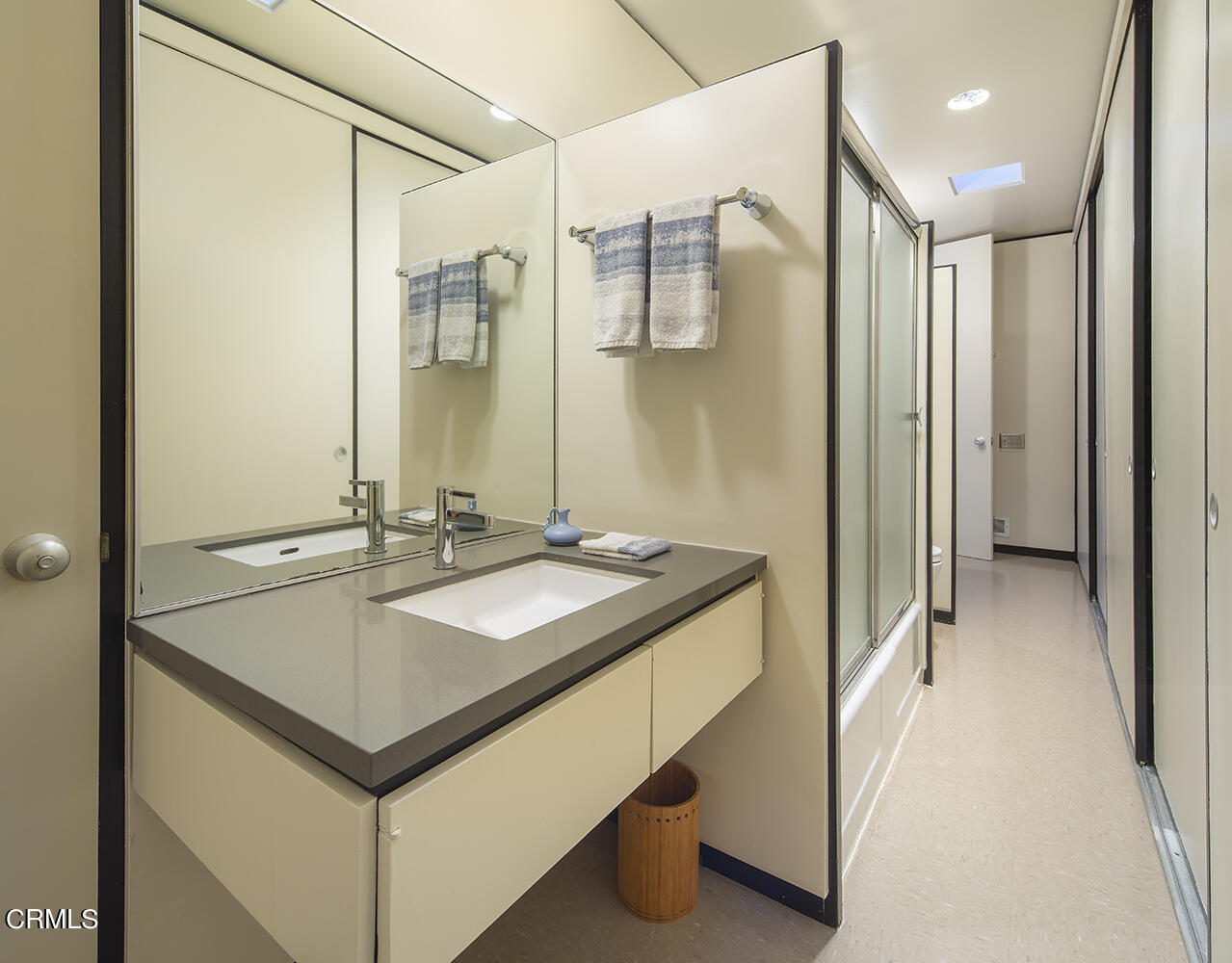 215 La Vereda Road Pasadena, CA 91105 - Photo 14 of 21 a bathroom with a sink and a mirror