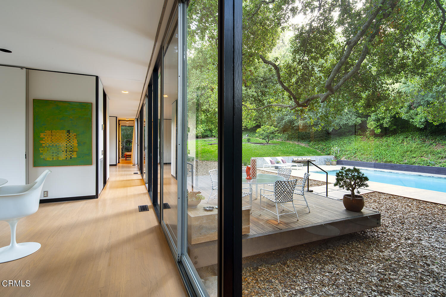 215 La Vereda Road Pasadena, CA 91105 - Photo 17 of 21 a view of a floor to ceiling window and a yard