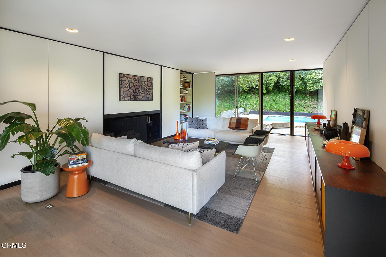 215 La Vereda Road Pasadena, CA 91105 - Photo 6 of 21 a living room with furniture potted plant and a large window