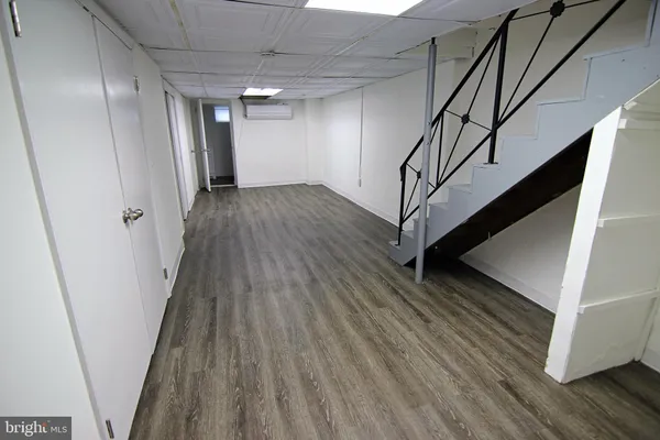 a white toilet sitting next to a bath tub