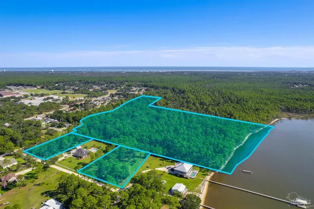 a view of a field with an ocean