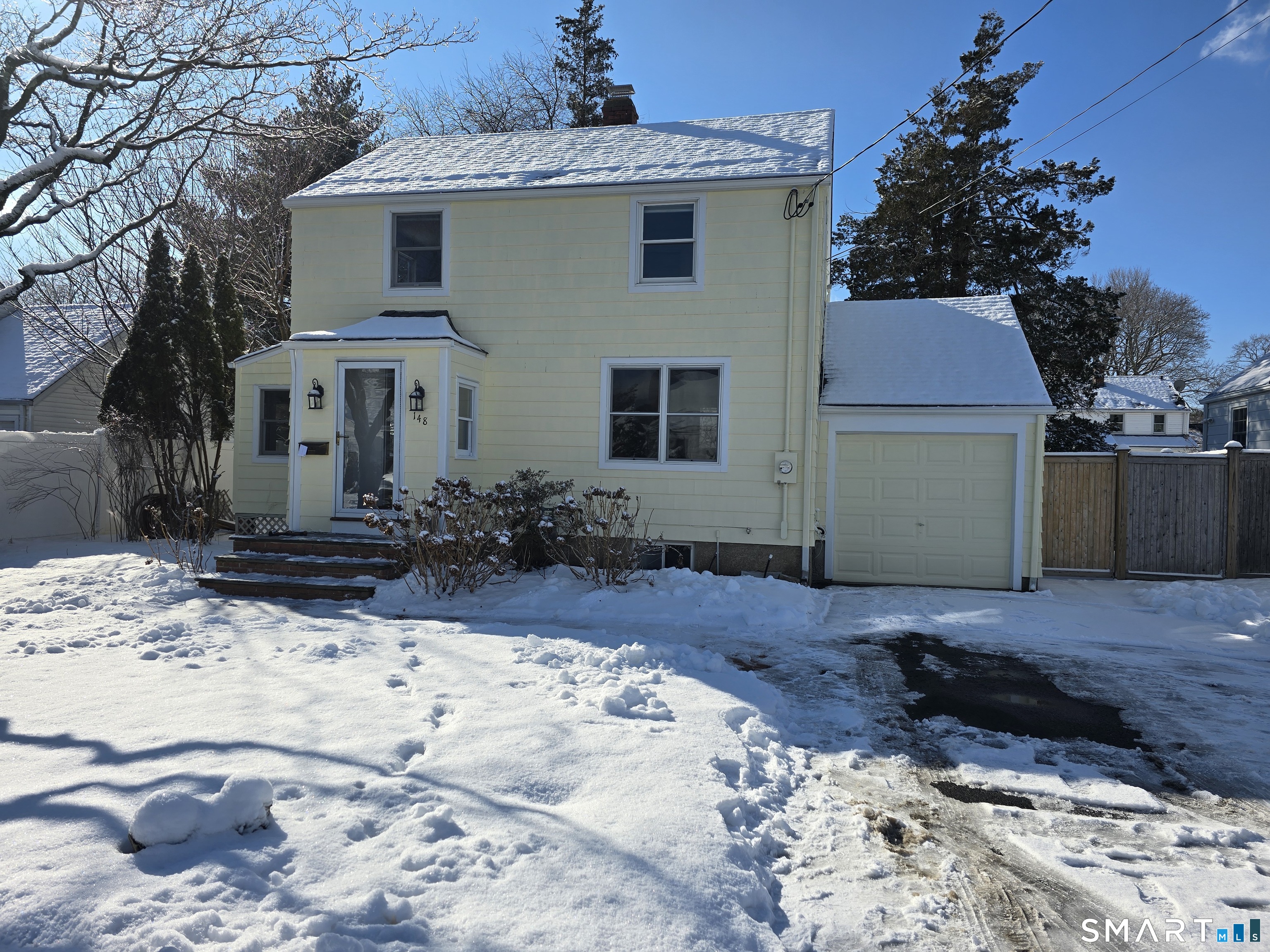a view of a yard with a tree