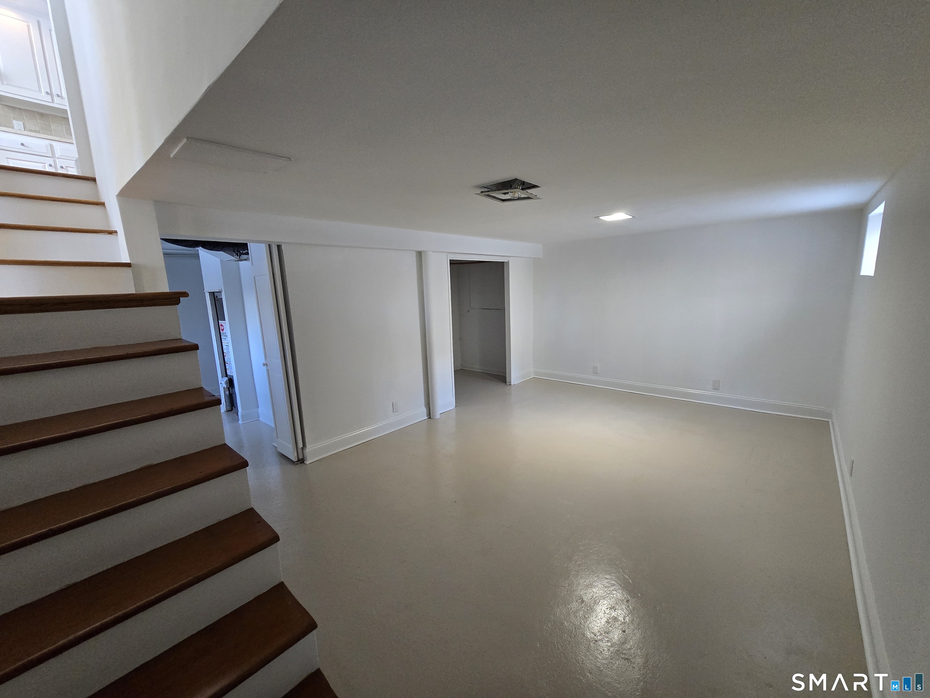 148 Catherine Street Fairfield, CT 06824 - Photo 14 of 25 a view of entryway with wooden floor
