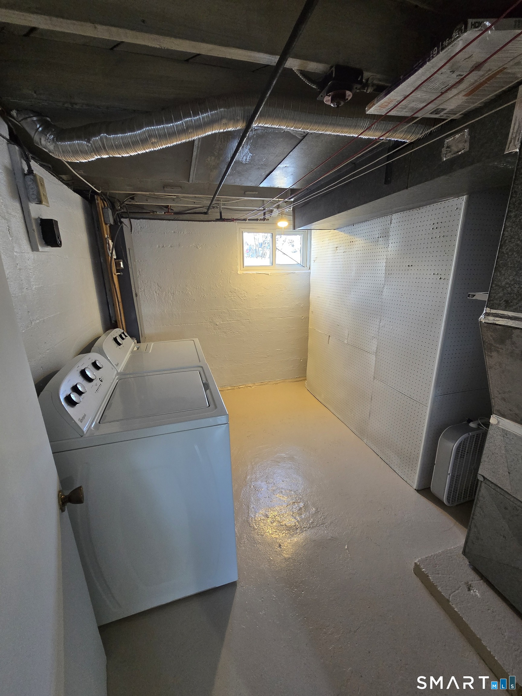 148 Catherine Street Fairfield, CT 06824 - Photo 17 of 25 a utility room with dryer and washer