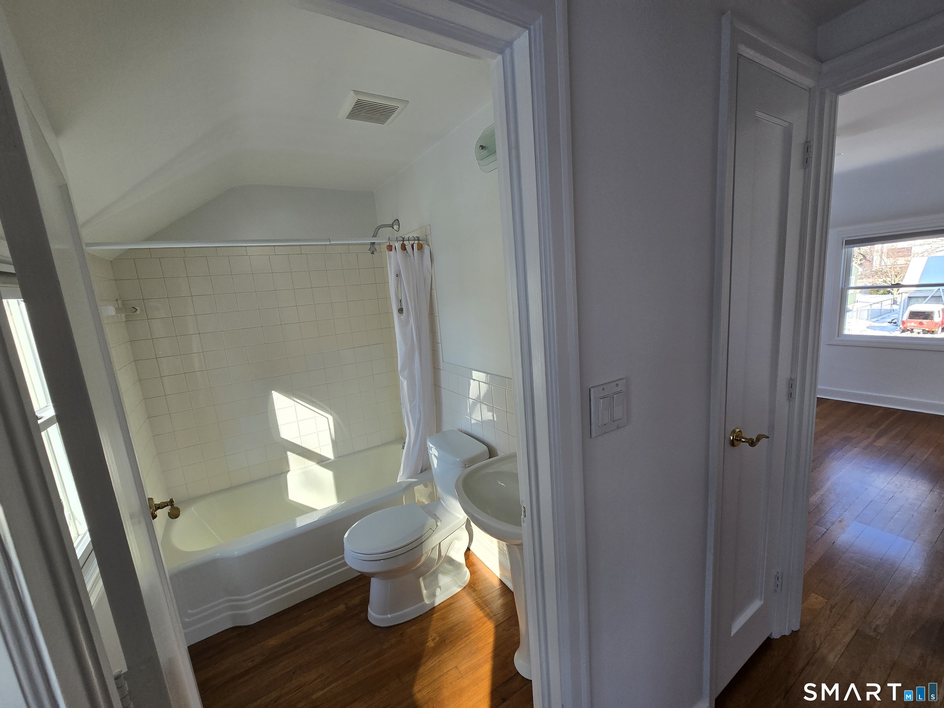 148 Catherine Street Fairfield, CT 06824 - Photo 25 of 25 a bathroom with a toilet and a shower