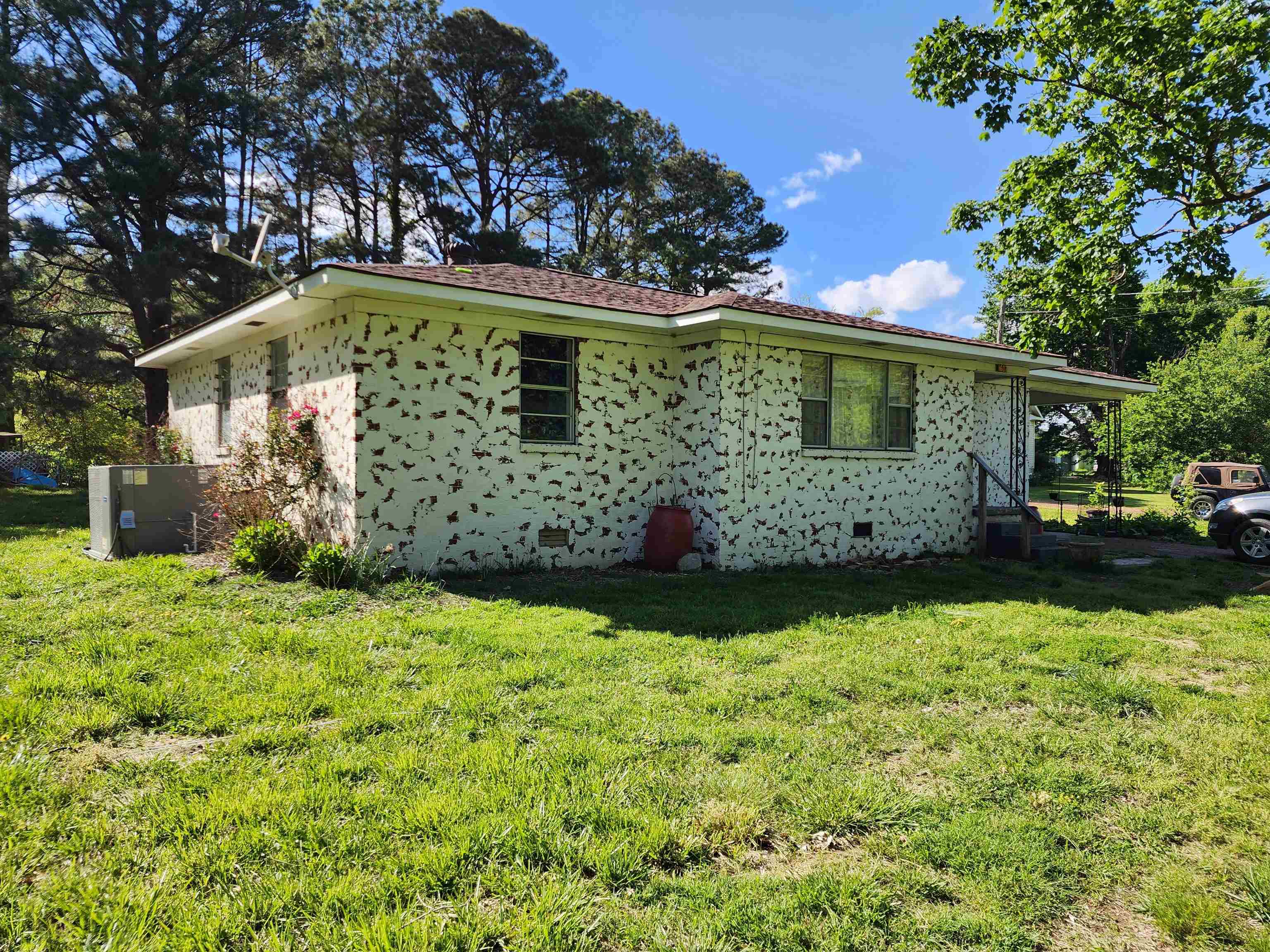 1607 Curve Nankipoo Road Ripley, TN 38063 - Photo 1 of 8 a front view of a house with garden