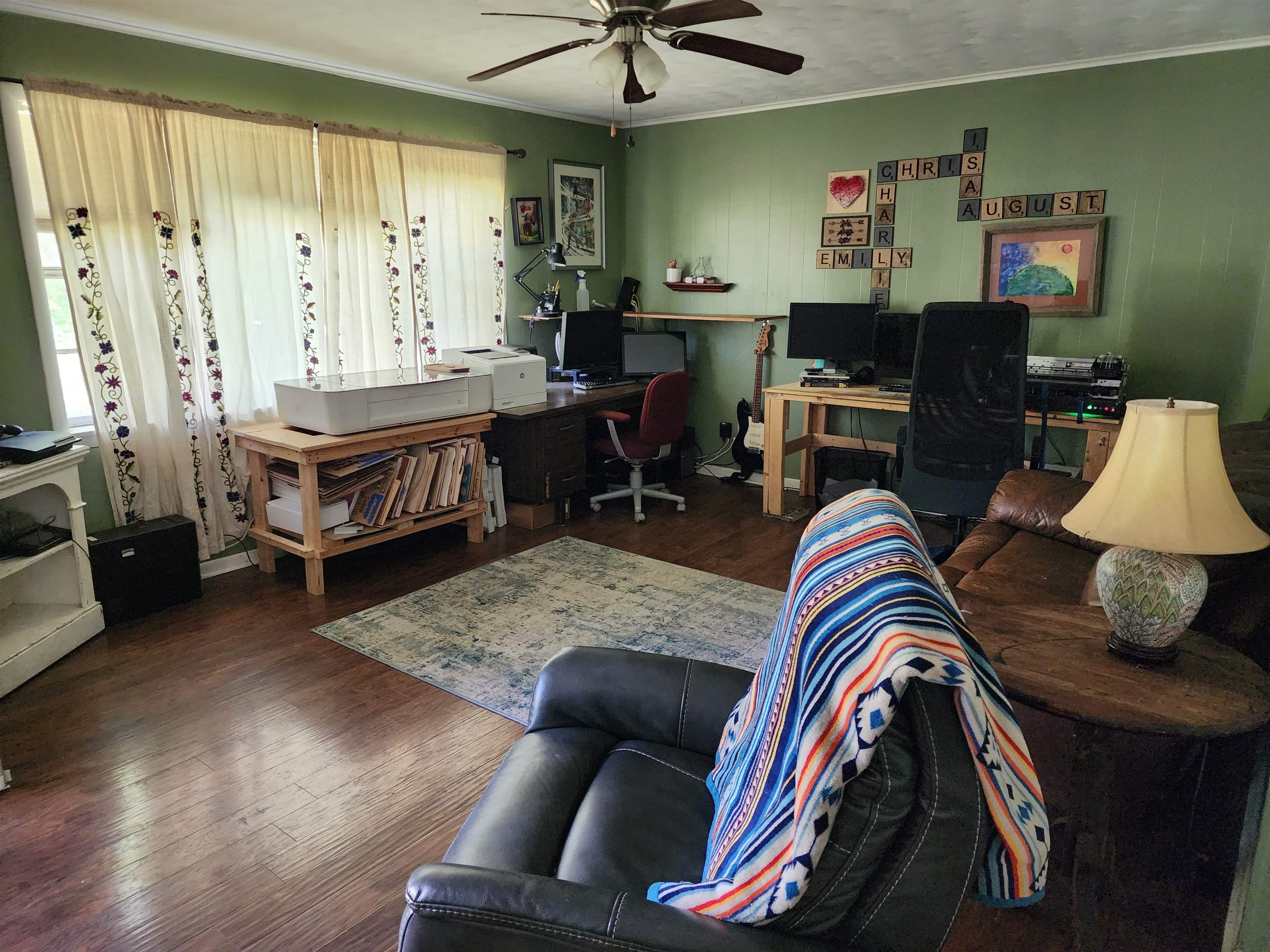 1607 Curve Nankipoo Road Ripley, TN 38063 - Photo 2 of 8 a living room with furniture and a wooden floor